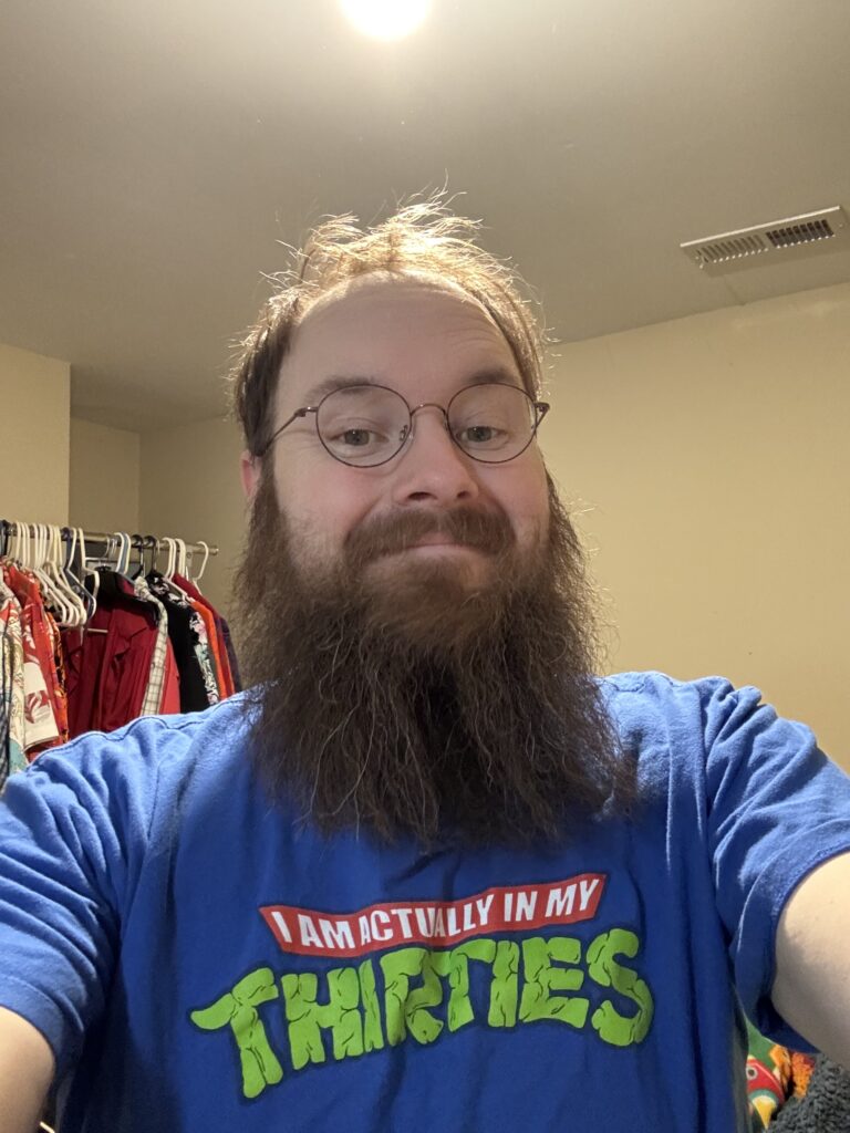 A selfie of Jonathan, smiling to the camera.